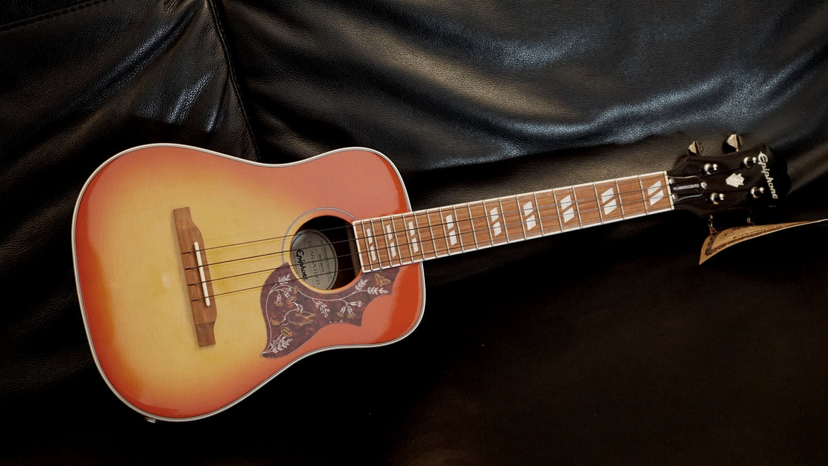 epiphone hummingbird ukulele tobacco sunburst Studio Tenor profile and the neck has a 17 scale length with 19 frets and a Granadillo fretboard Epiphone Hummingbird Tenor Ukulele Acoustic